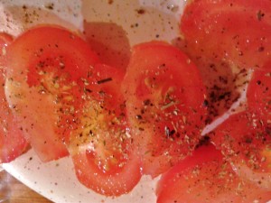 tomatoes seasoned with salt, pepper and oregano